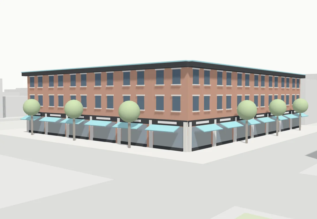 The corner storefront at Mill and Main, with awnings over the shop windows and street trees along the curb